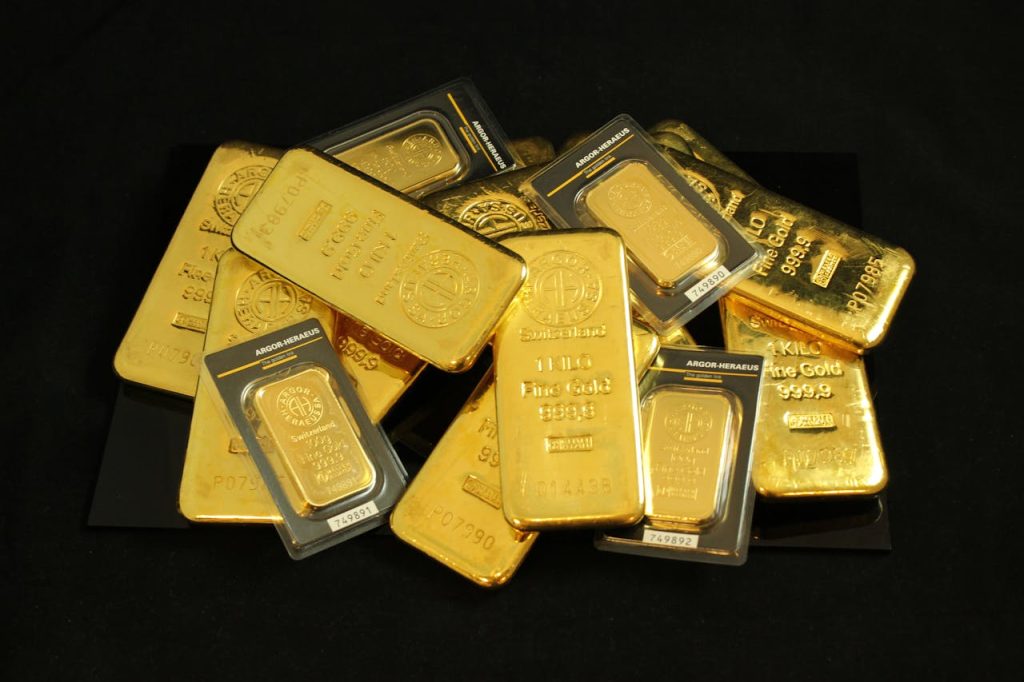A collection of precious gold bars stacked elegantly, symbolizing wealth and prosperity.